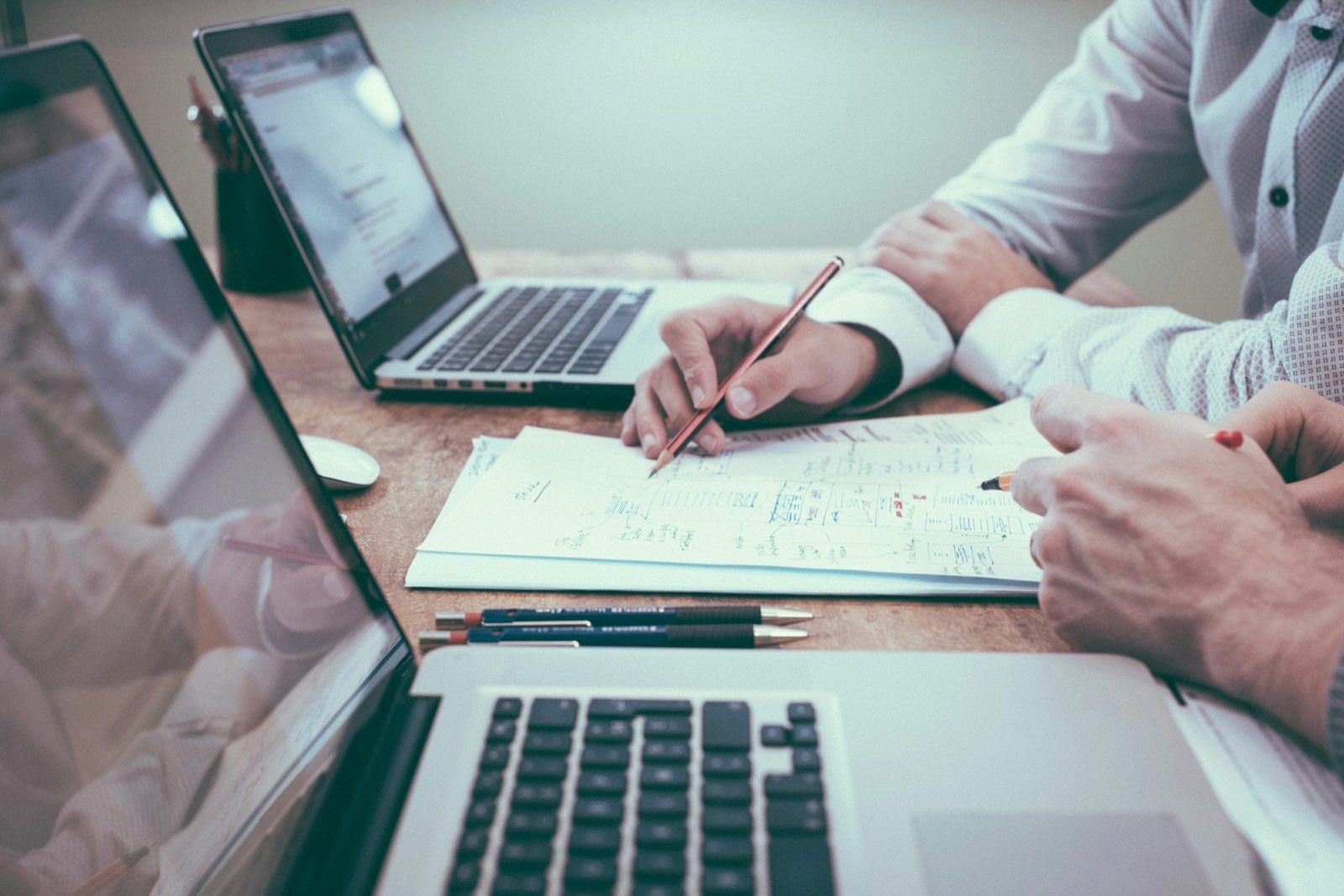 An advisor at a desk with a laptop