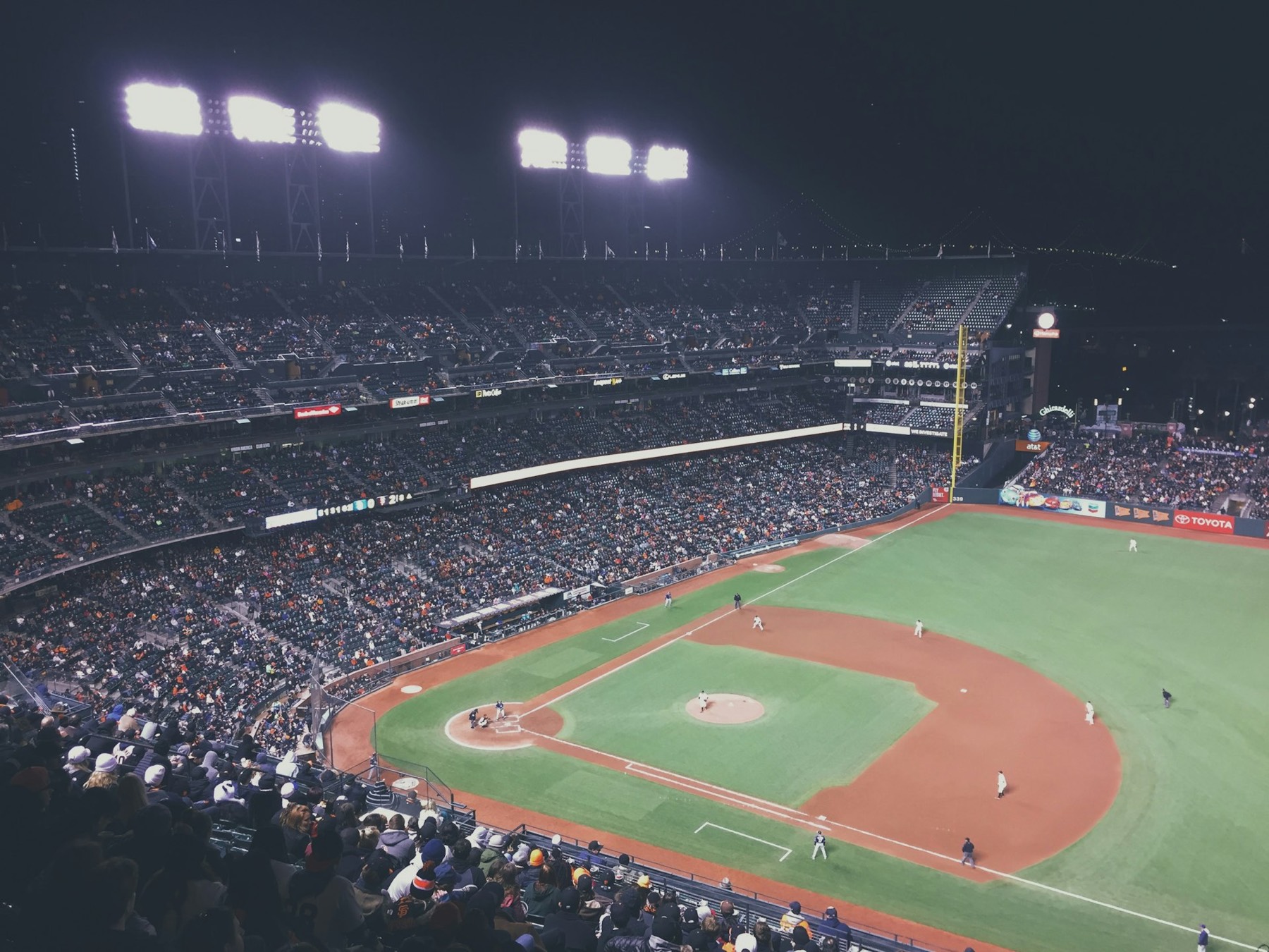 A ballpark under the lights at night