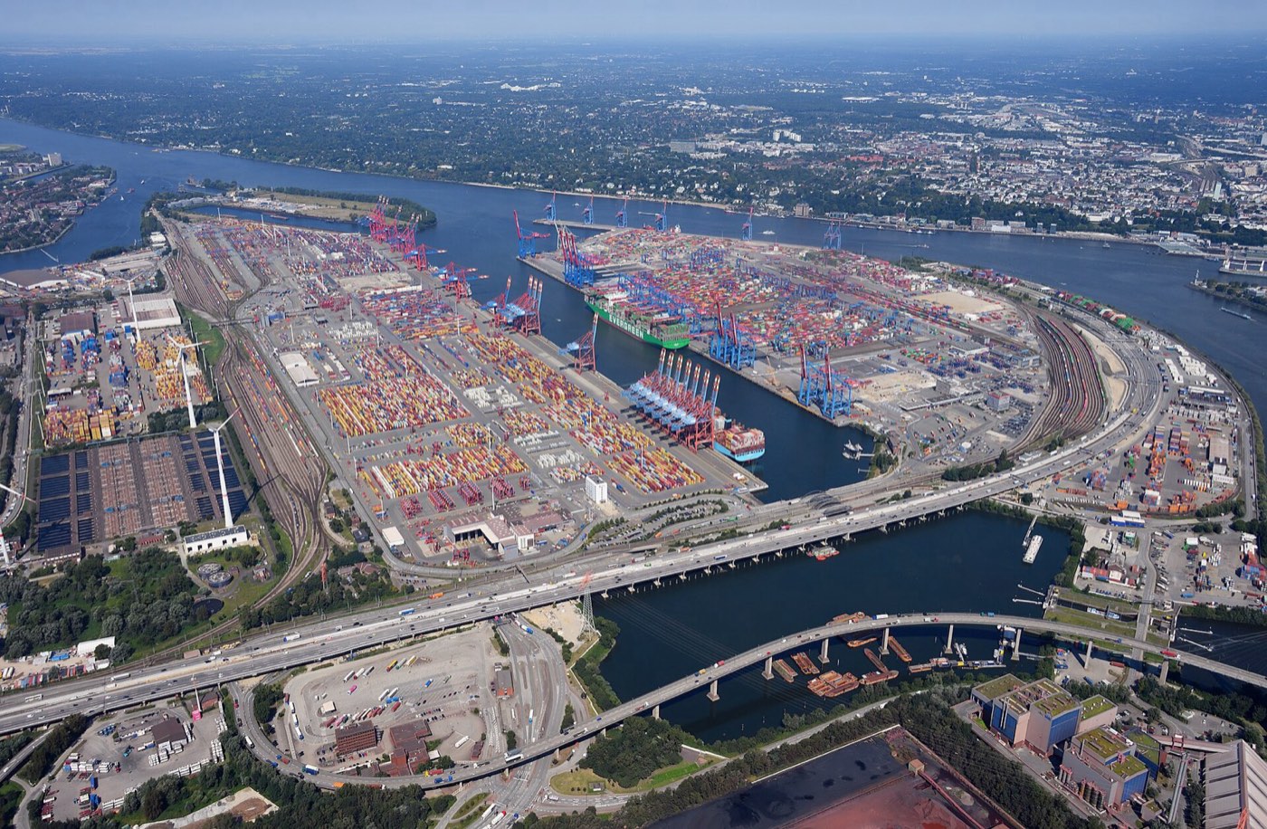 Container terminals seen from the air: ships at the quays, gantry cranes, container stacks and rail yards